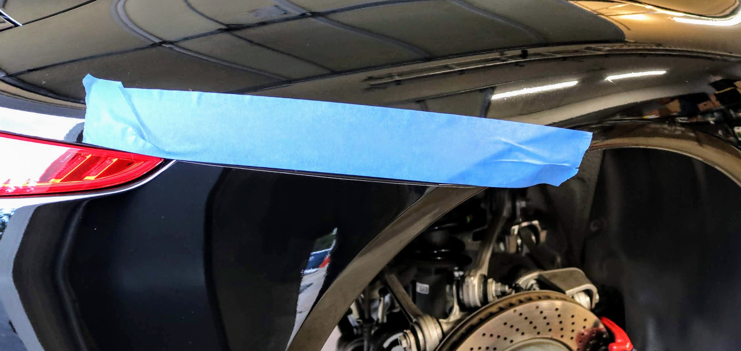 Porsche 911 (991) painters tape for rear bumper removal